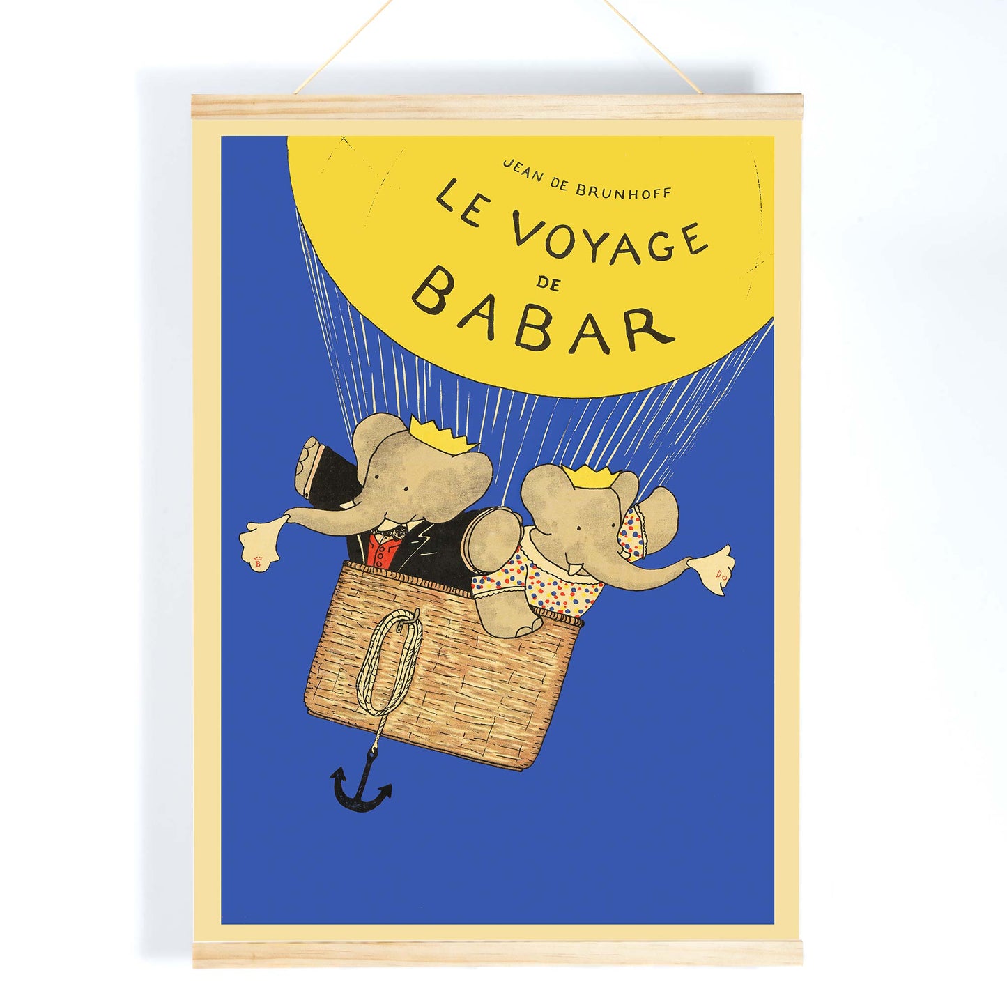 Le Voyage de Babar by Jean de Brunhoff illustration and poster featuring elephants in a hot air balloon with a yellow balloon on a blue background, with wooden magnetic frame on white background