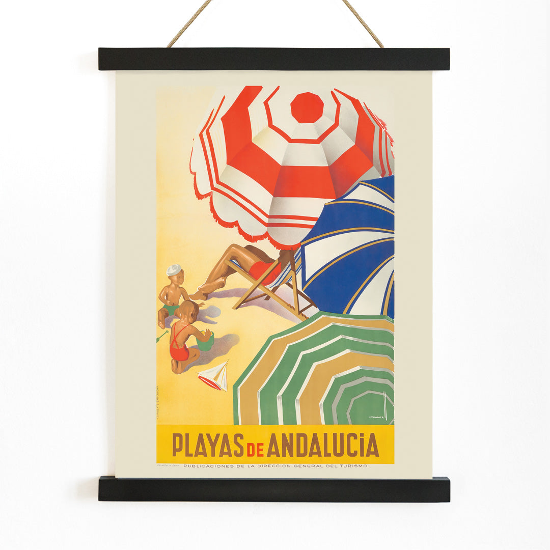 Vintage beach scene with colorful umbrellas children playing and sunbathers on sand Playas de Andalucia by Jose Morell tourism artwork, with wooden magnetic frame on white background