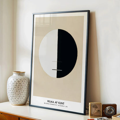 Black and white circle artwork poster Buddha Standpoint In Early Life by Hilma AF Klint with divided circle on beige background, framed and displayed in home decor