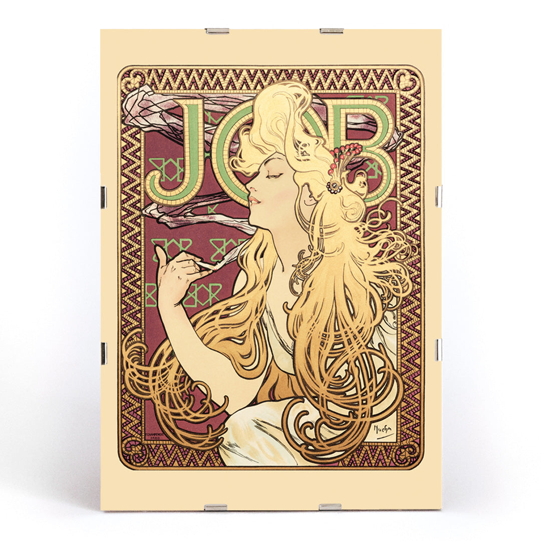 Art Nouveau poster of elegant woman with flowing hair holding a cigarette and decorative patterns by Alphonse Mucha, framed and displayed in modern living room decor