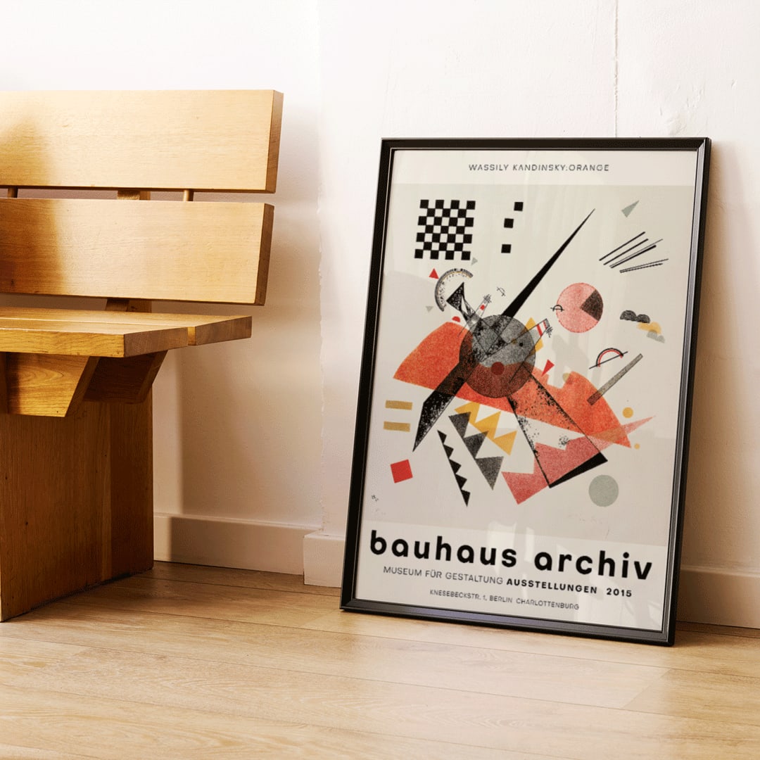 Abstract artwork Orange Bauhaus exhibition poster by Wassily Kandinsky featuring abstract geometric shapes in various colors, framed and displayed in home decor