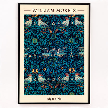 Closeup detail of Night Birds by William Morris colorful patterned illustration and poster with intricate birds and floral designs in rich blue and green tones