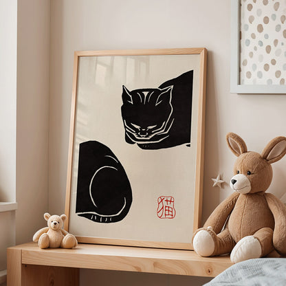 Ink illustration and poster of a stylized black cat with minimalist brush strokes by Black Cat 4 artist and Anonymous, framed and displayed in modern living room decor