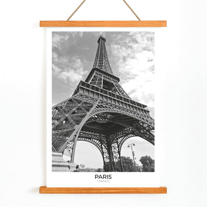 Black and white picture of the Eiffel Tower in Paris featuring its intricate structure by artist poster titled Tour Eiffel Black and White, with wooden magnetic frame on white background