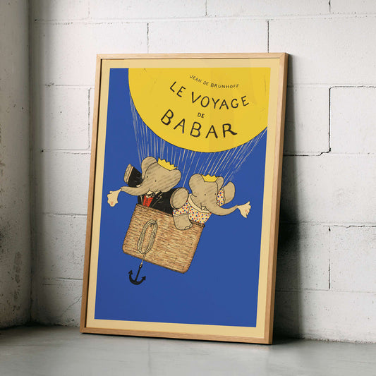 Le Voyage de Babar by Jean de Brunhoff illustration and poster featuring elephants in a hot air balloon with a yellow balloon on a blue background, framed and displayed in home decor