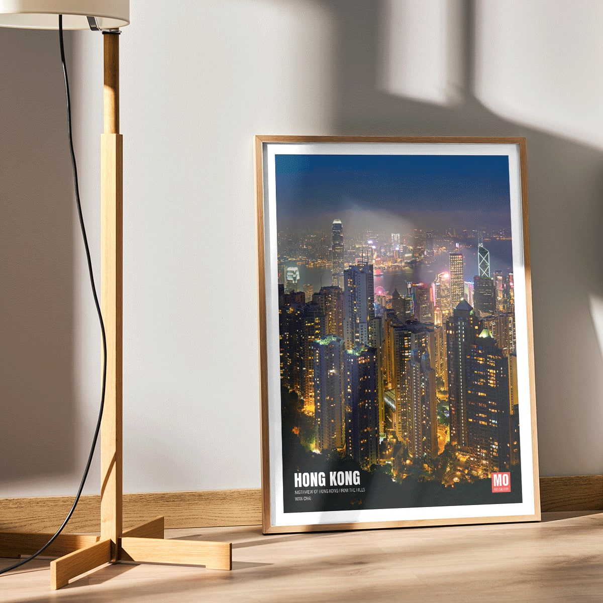 Hong Kong Nightview by Mo Art Gallery featuring a vibrant illuminated city skyline and skyscrapers at night, framed and displayed in home decor