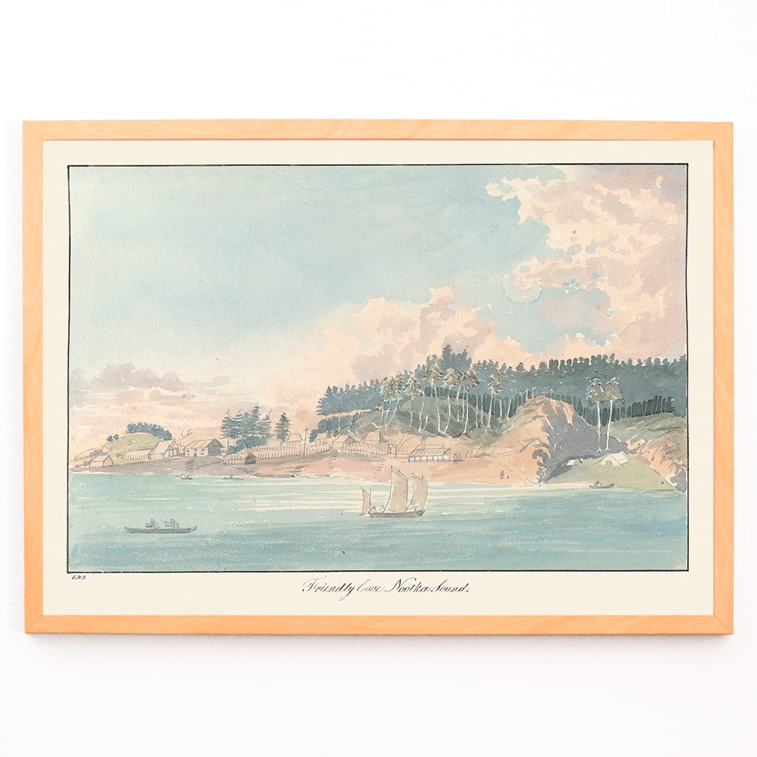 Seaside village and coastal landscape painting with sailboats and forested hill titled Friendly Cove Nootka Sound by Charles Hamilton Smith, framed and displayed in modern living room decor
