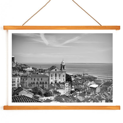 Lisbon Old City Landscape Black and White Picture 1 showing historic buildings rooftops and ocean view waterfront poster, with wooden magnetic frame on white background