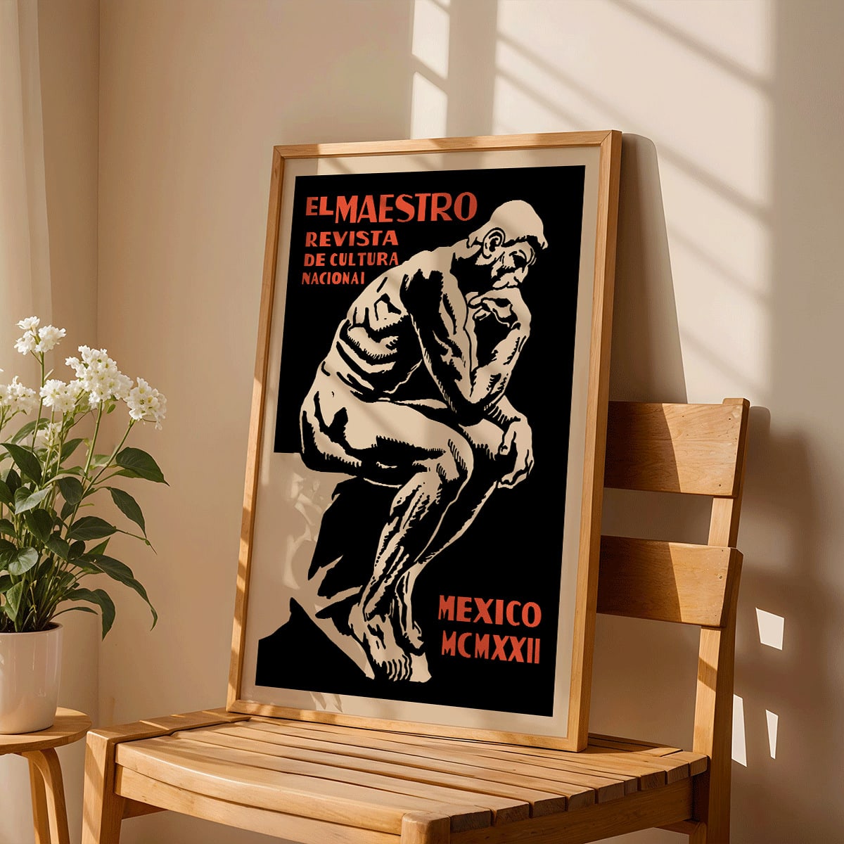 El Maestro Revista de Cultura Nacional Magazine cover and poster featuring a bold graphic thinker statue artwork, framed and displayed in modern living room decor