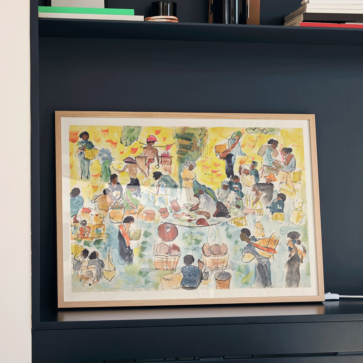 Vibrant market scene in the Dutch East Indies by Pierre Jean Apol featuring bustling merchants and colorful goods, framed and displayed in modern living room decor