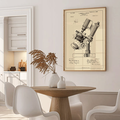 Detailed illustration and poster of microscope patent by E Bausch featuring detailed drawing titled Microscope Patent, framed and displayed in home decor