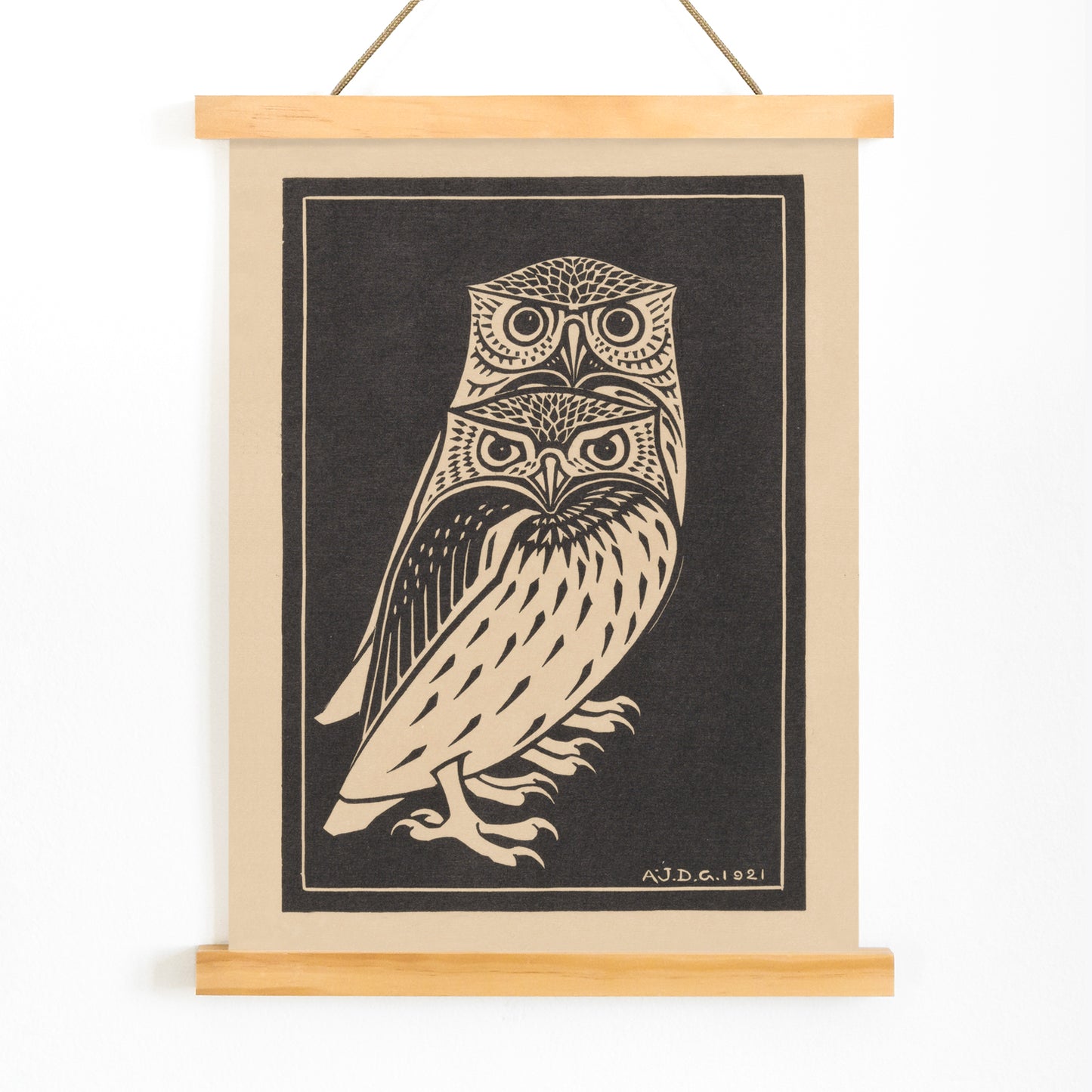 Stylized black and white owls artwork by Julie de Graag titled Two black and white owls illustration and poster, with wooden magnetic frame on white background