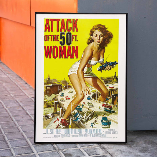 Giant woman towering over city and highway holding cars Attack of the 50ft Woman poster artwork by Reynold Brown, framed and displayed in home decor