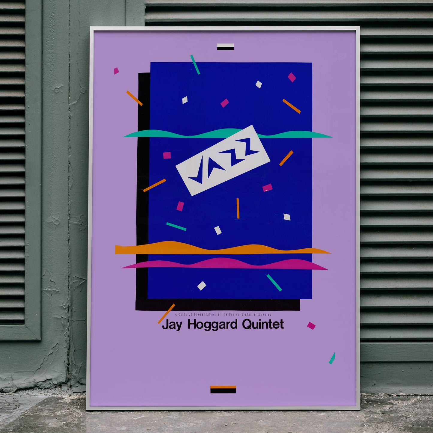 Colorful poster with abstract design and text Jazz Jay Hoggard Quintet featuring vibrant colors geometric shapes and unique artwork, framed and displayed in home decor