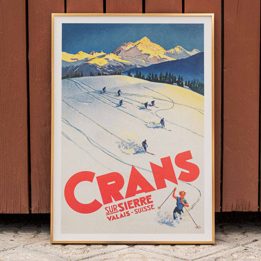 Crans sur Sierre Switzerland Ski Poster by Martin Peikert with skiers descending snowy mountain slopes and vibrant mountain backdrop, framed and displayed in home decor