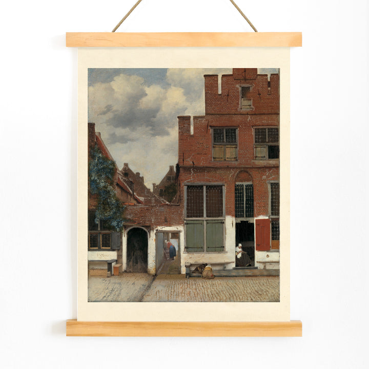 Poster of a charming street scene with brick houses and figures from View of Houses in Delft The Little Street by Johannes Vermeer, with wooden magnetic frame on white background
