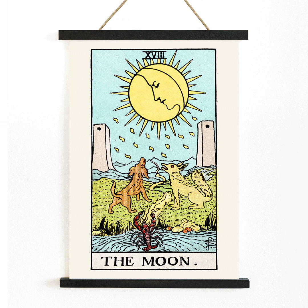 Tarot The Moon by Rider Waite poster featuring celestial moon two towers two dogs and a crayfish in a mystical landscape, with wooden magnetic frame on white background
