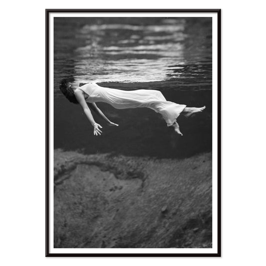 Underwater woman in white flowing dress at Weeki Wachee spring Florida by Toni Frissell, with black aluminium frame on white background