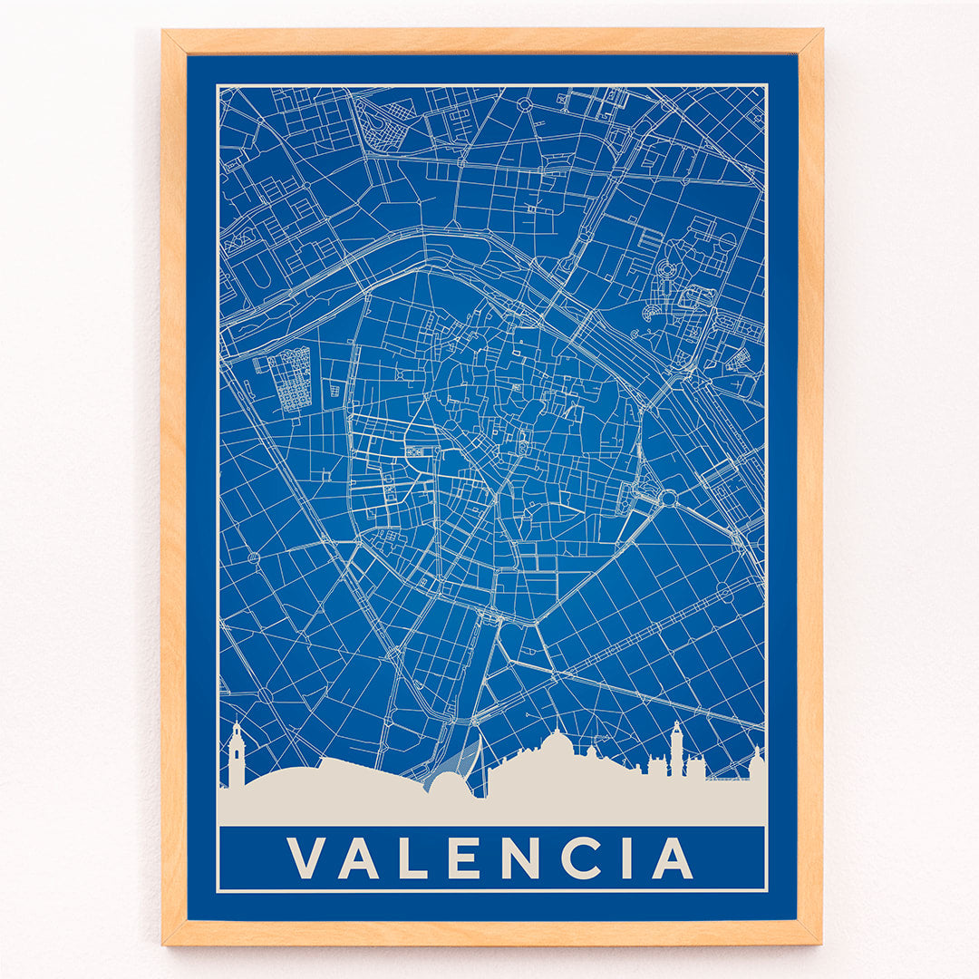Minimalist Valencia Map poster by artist Minimalist featuring a detailed blue and white city map and skyline, framed and displayed in modern living room decor