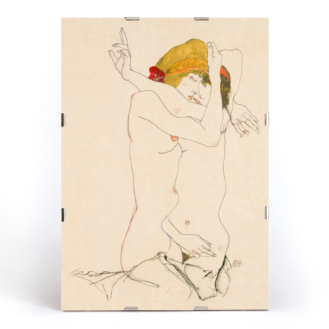 Two Women Embracing by Egon Schiele expressive artwork poster featuring two nude women in an intimate pose, framed and displayed in modern living room decor
